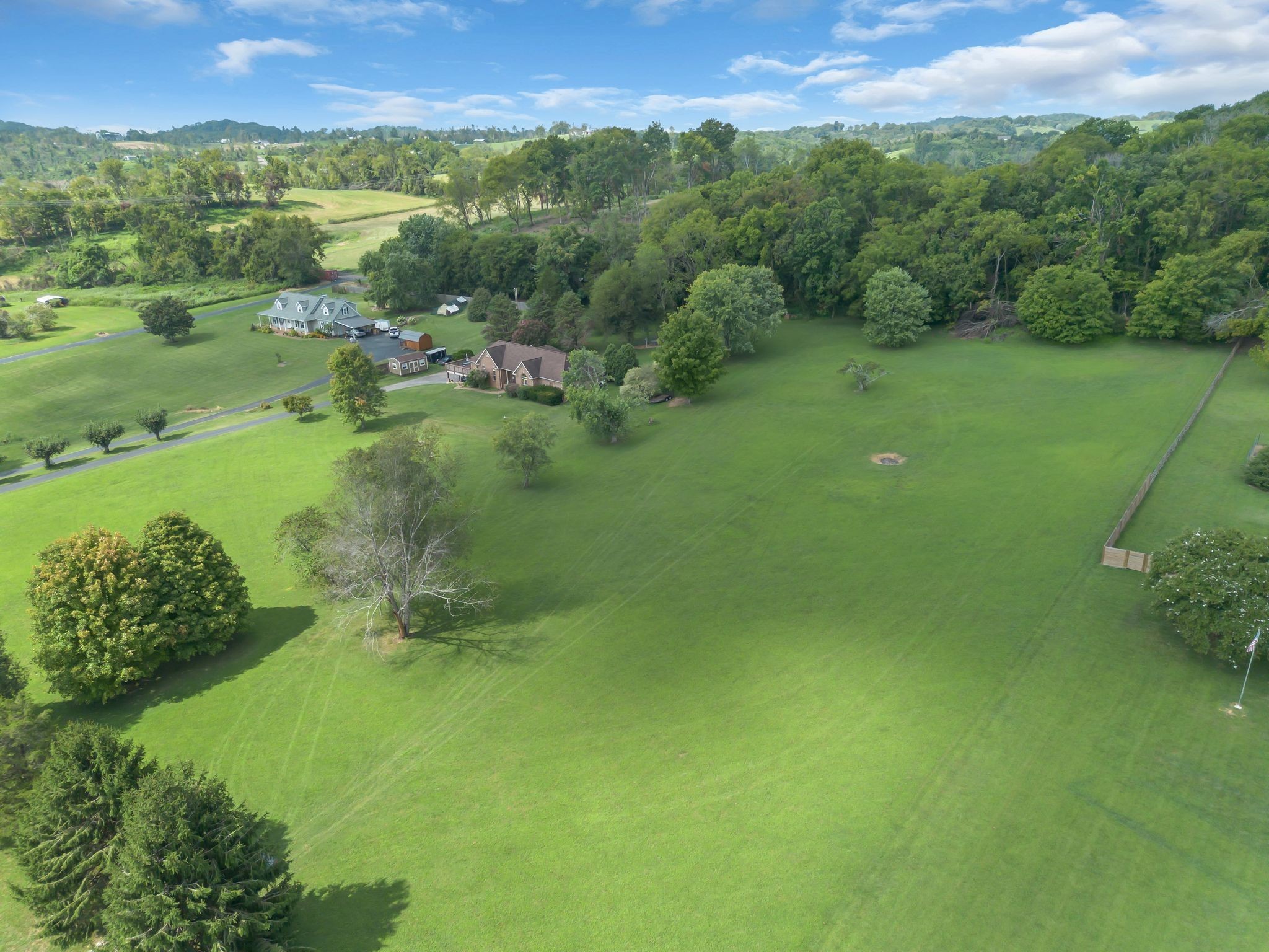 1863 Clara Mathis Road Spring Hill, TN 37174 - Photo 3 of 14 a view of a lush green outdoor space with a lake view