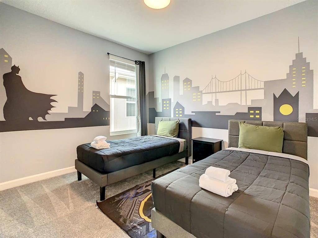 2908 Protagonist Street Kissimmee, FL 34746 - Photo 12 of 32 a living room with furniture and wooden floor