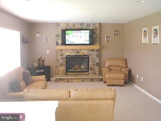 479 Colts Run Road Williamstown, NJ 08094 - Photo 2 of 6 a living room with furniture and a fireplace