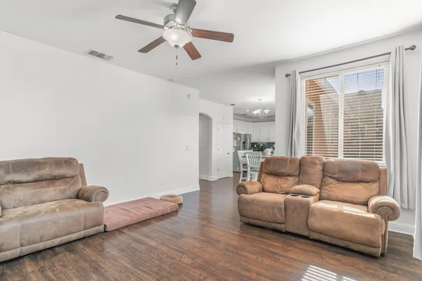 a living room with furniture and a large window