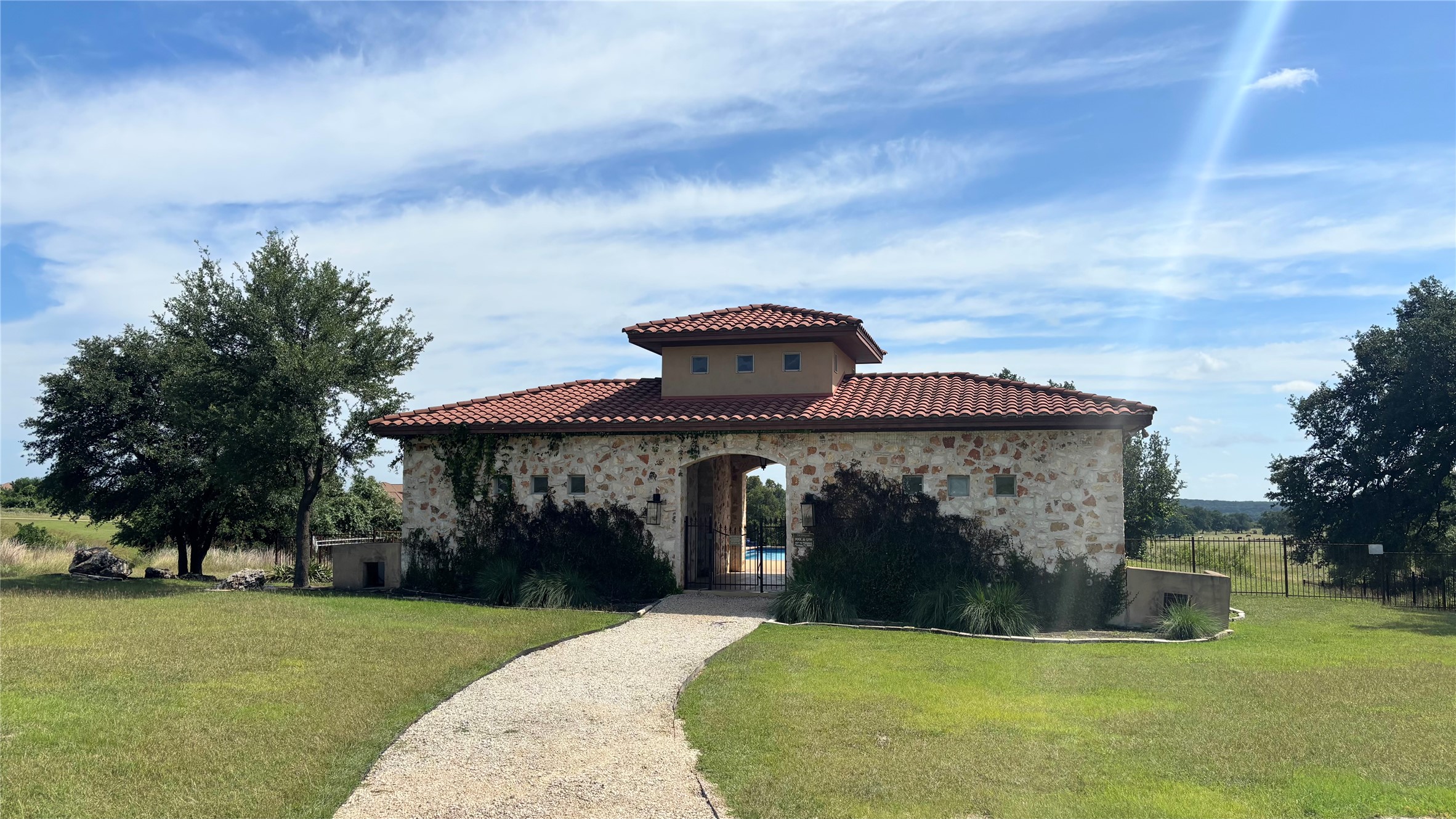 104 Strada Luca Florence, TX 76527 - Photo 11 of 13 Enter this distinguished community through an impressive stone and tile gatehouse leading to lush grounds.