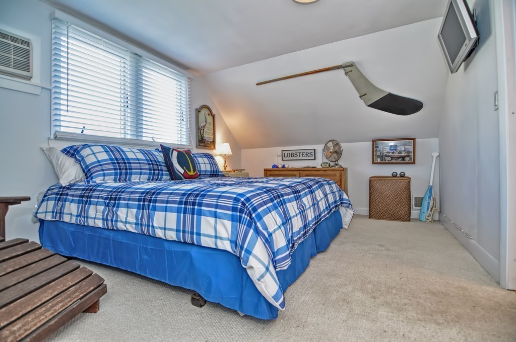 56 Marmion Way Rockport, MA 01966 - Photo 16 of 30 a bedroom with a bed and window