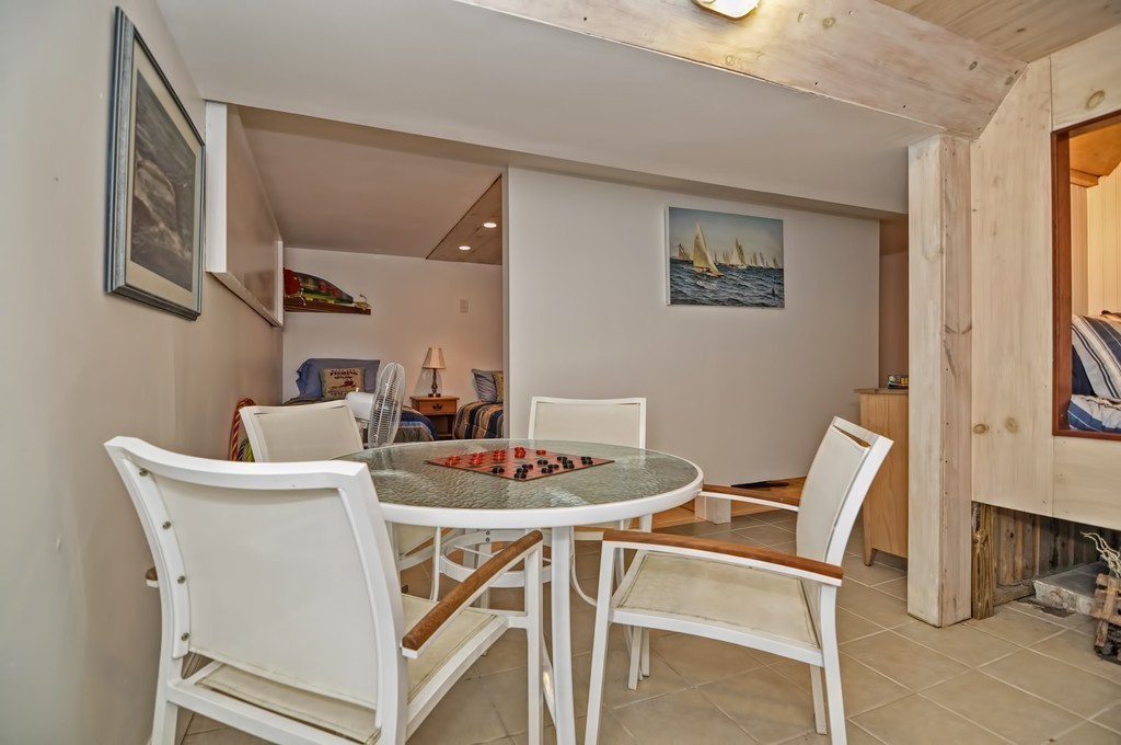56 Marmion Way Rockport, MA 01966 - Photo 20 of 30 a dining room with furniture and a window