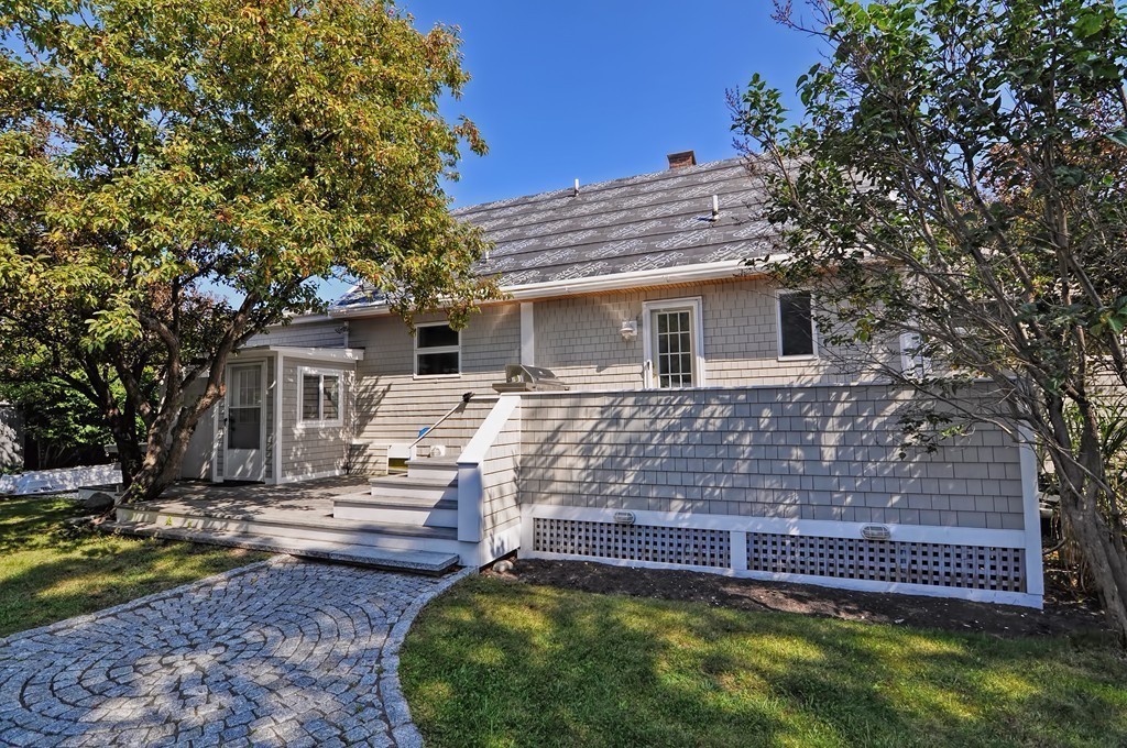 56 Marmion Way Rockport, MA 01966 - Photo 26 of 30 a front view of a house with a yard