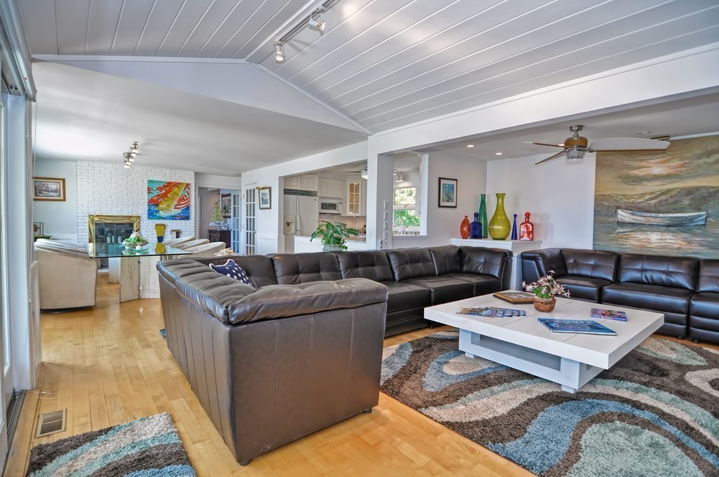 56 Marmion Way Rockport, MA 01966 - Photo 4 of 30 a living room with furniture and a rug