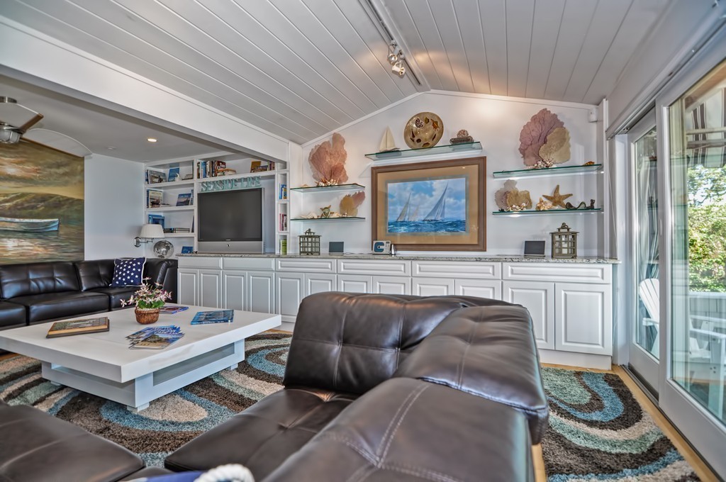 56 Marmion Way Rockport, MA 01966 - Photo 7 of 30 a living room with furniture and a large window