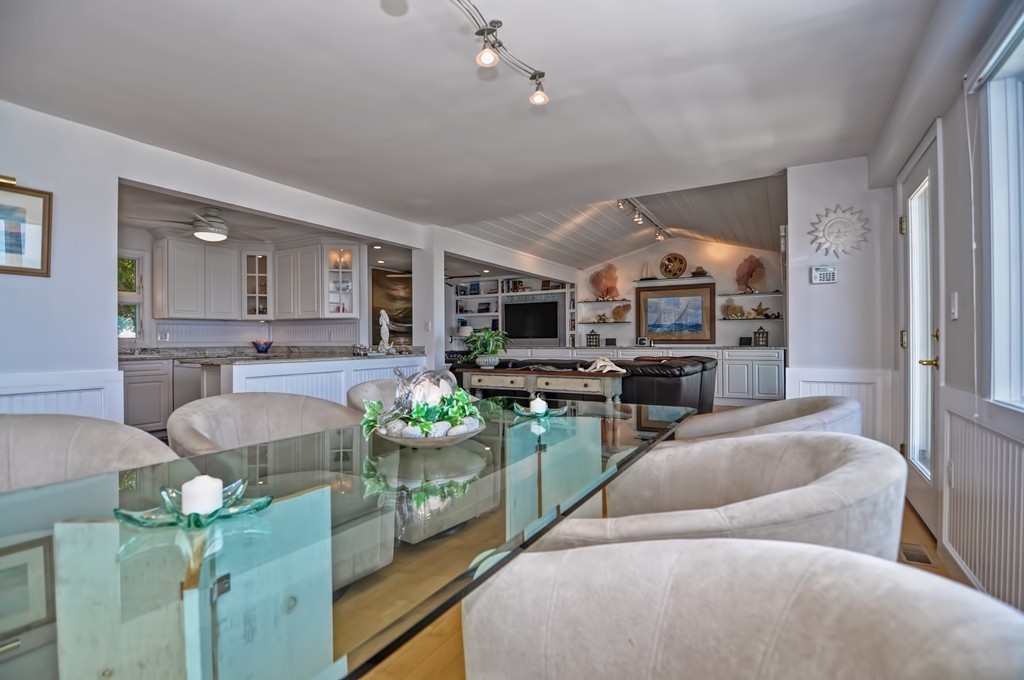 56 Marmion Way Rockport, MA 01966 - Photo 8 of 30 a living room with furniture and a fireplace