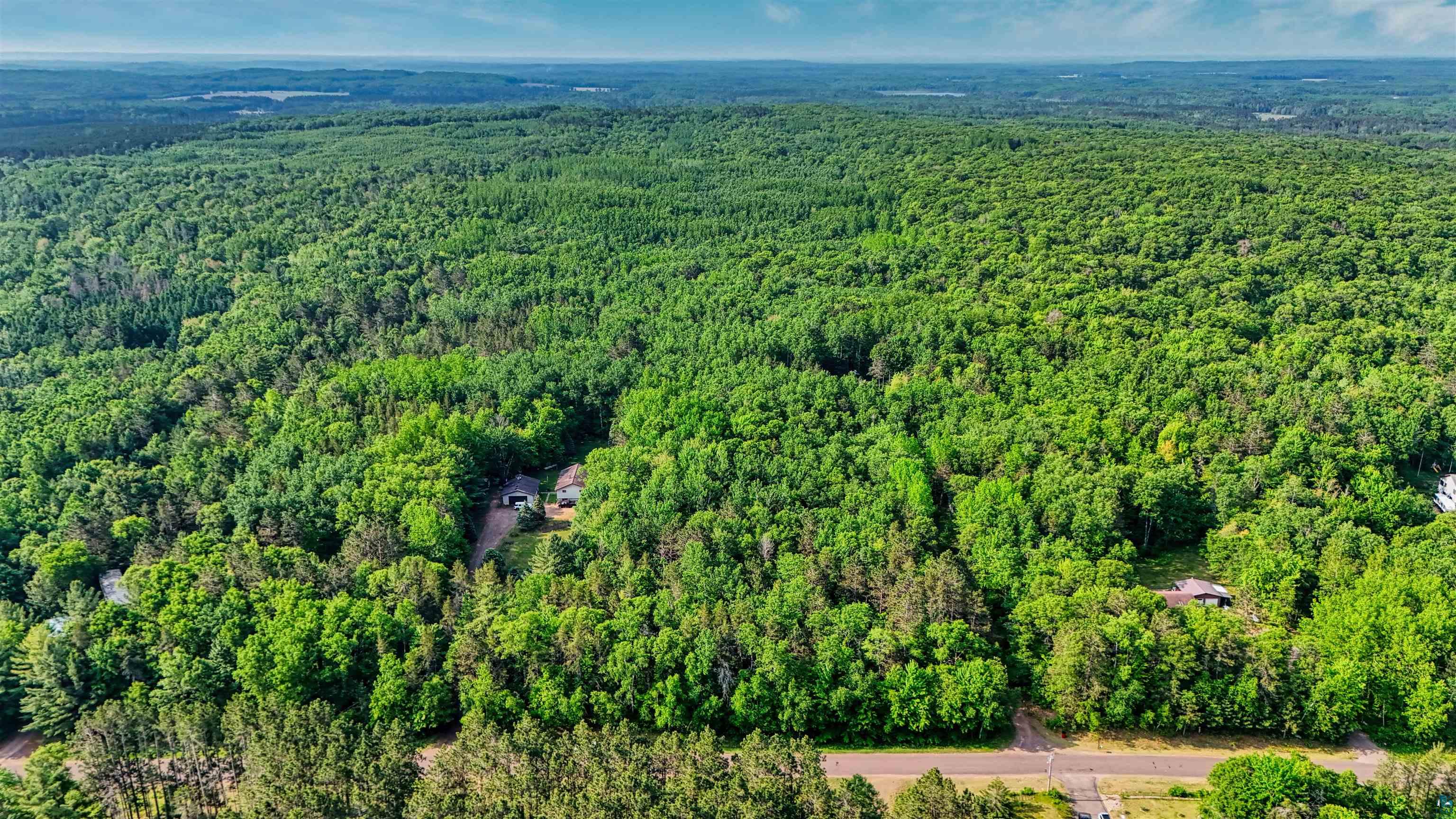 5-acres On Spring Lake Road Trego, WI 54888 - Photo 4 of 16 Aerial view of property and surrounding area featuring a heavily wooded area