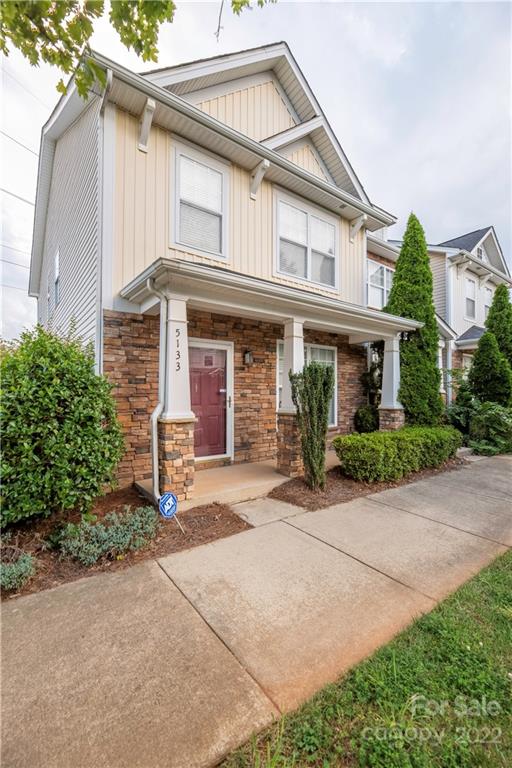 5133 Prosperity Church Road Charlotte, NC 28269 - Photo 1 of 37 a front view of a house with garden