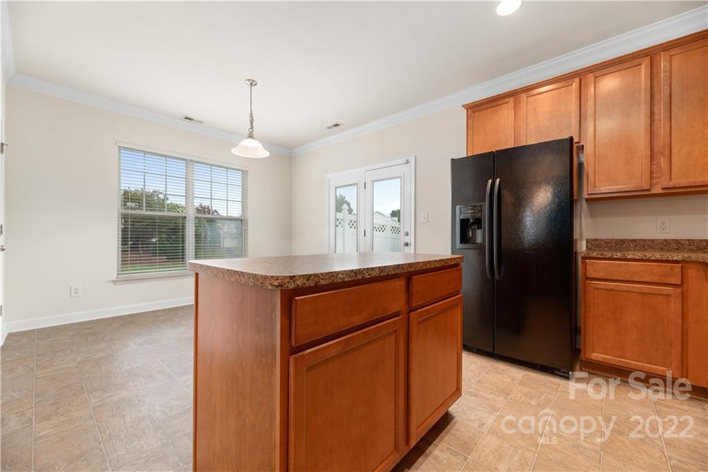 5133 Prosperity Church Road Charlotte, NC 28269 - Photo 12 of 37 a kitchen with stainless steel appliances granite countertop a refrigerator a sink and dishwasher