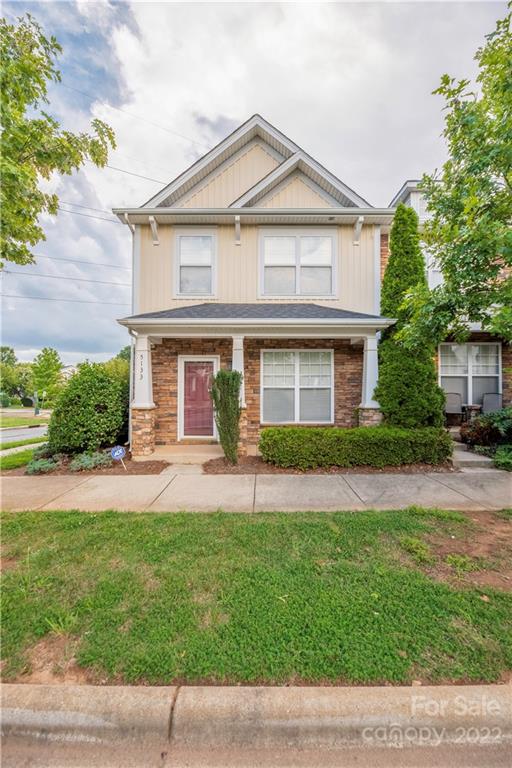 5133 Prosperity Church Road Charlotte, NC 28269 - Photo 2 of 37 a front view of a house with a yard and garage