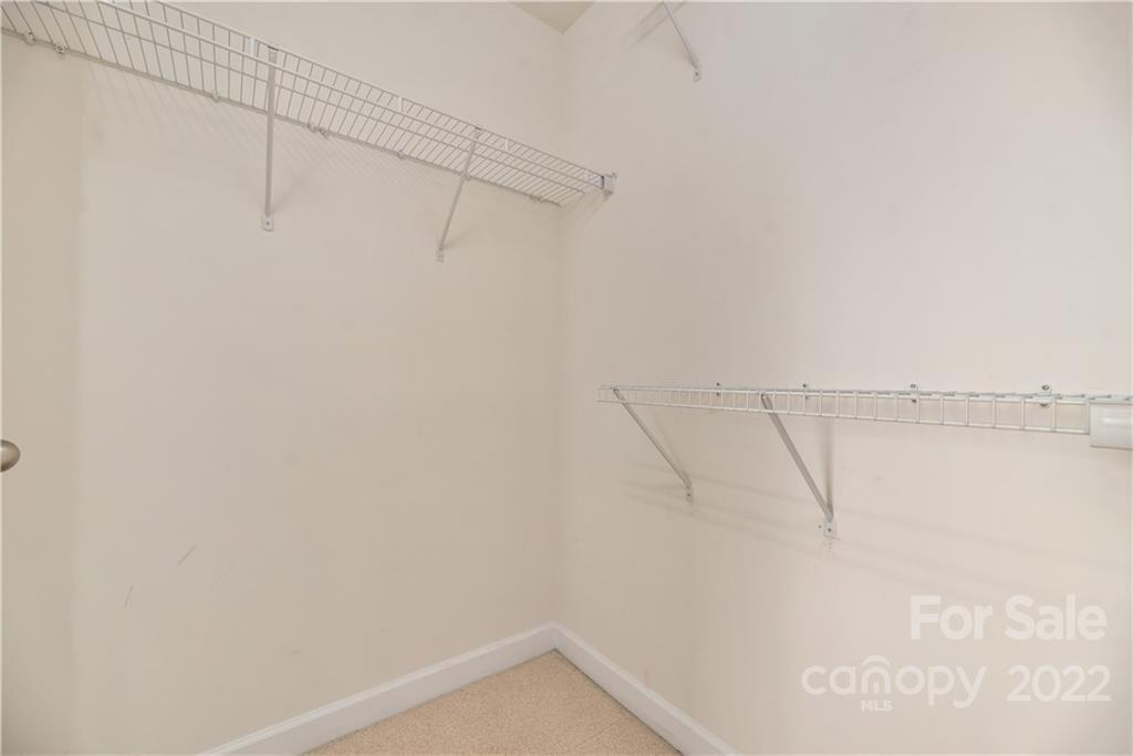 5133 Prosperity Church Road Charlotte, NC 28269 - Photo 25 of 37 a view of a room with racks on the wall