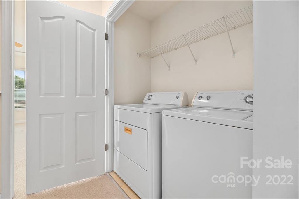 5133 Prosperity Church Road Charlotte, NC 28269 - Photo 32 of 37 a utility room with dryer and washer