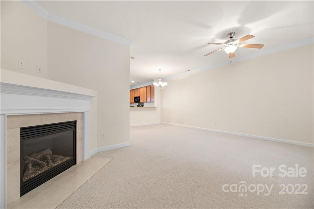 5133 Prosperity Church Road Charlotte, NC 28269 - Photo 7 of 37 a view of empty room with window and fireplace