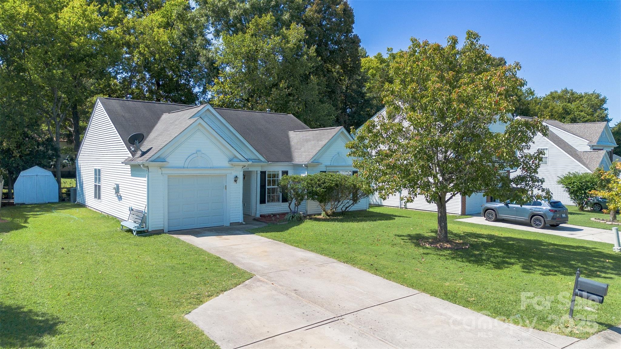 14034 Dingess Road, Unit 101 Charlotte, NC 28273 - Photo 1 of 24 a front view of a house with yard