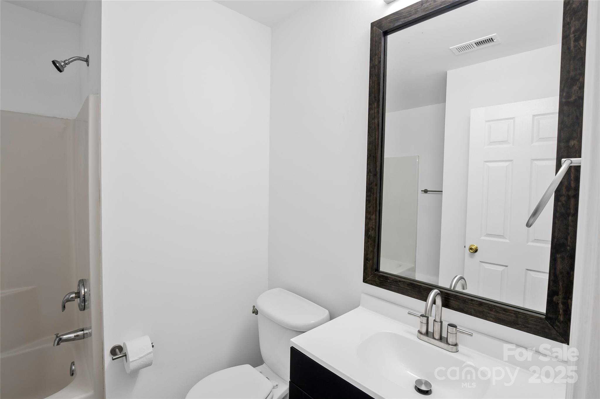 14034 Dingess Road, Unit 101 Charlotte, NC 28273 - Photo 14 of 24 a bathroom with a sink and a mirror