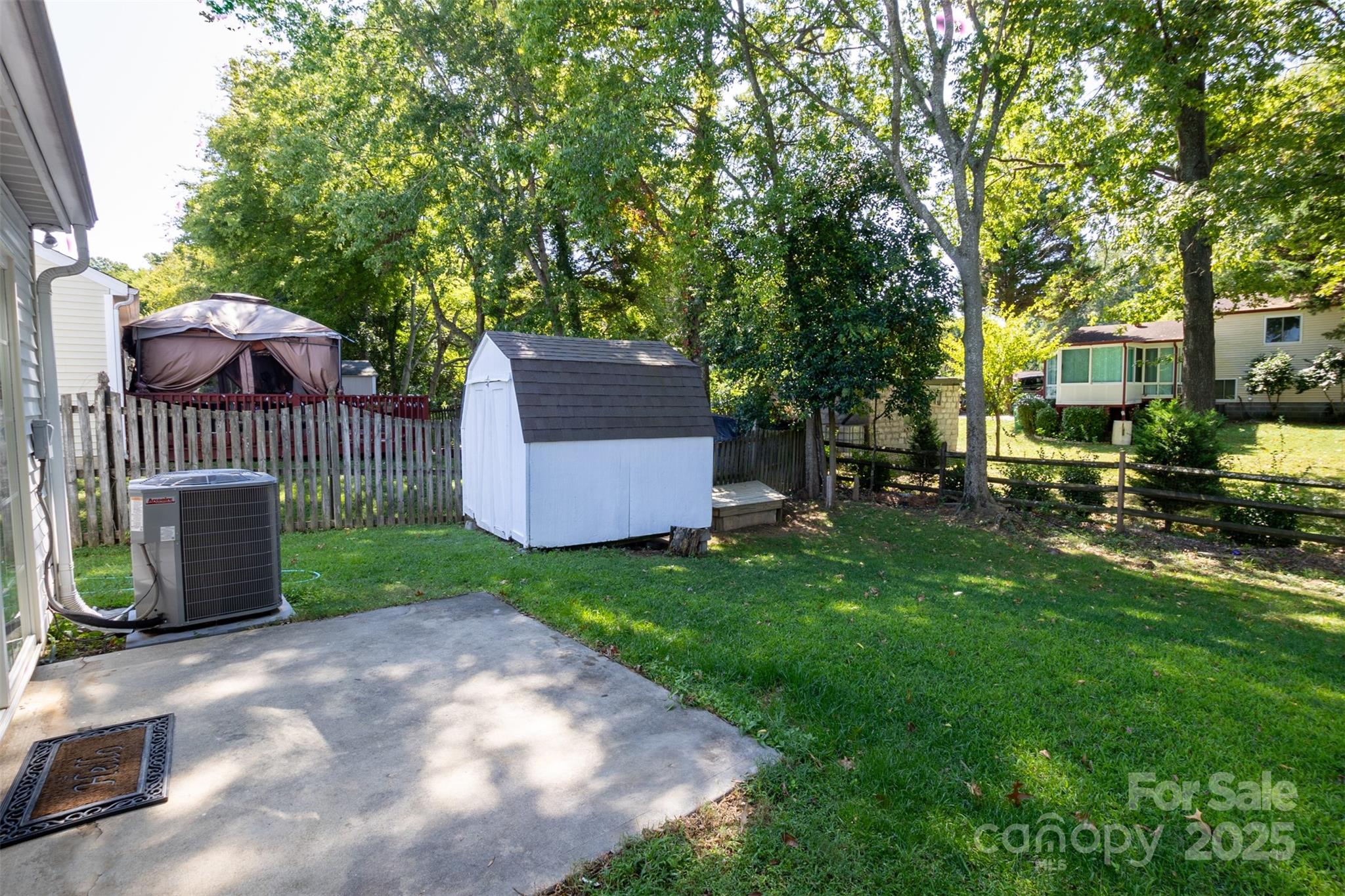 14034 Dingess Road, Unit 101 Charlotte, NC 28273 - Photo 21 of 24 a view of a house with a yard and sitting area