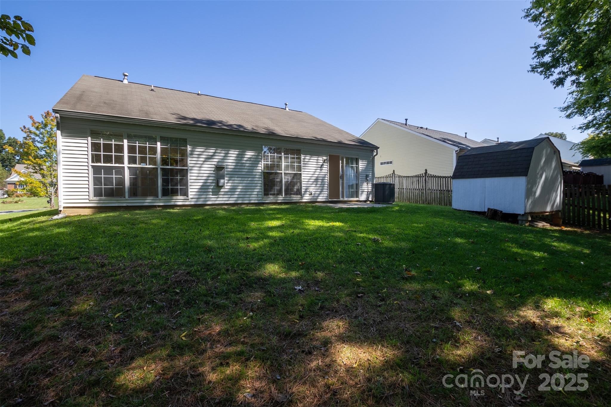 14034 Dingess Road, Unit 101 Charlotte, NC 28273 - Photo 22 of 24 a view of a house with a yard and sitting area
