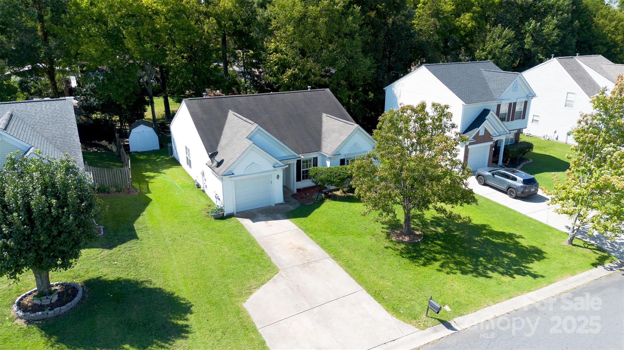 14034 Dingess Road, Unit 101 Charlotte, NC 28273 - Photo 23 of 24 an aerial view of a house with garden space and street view