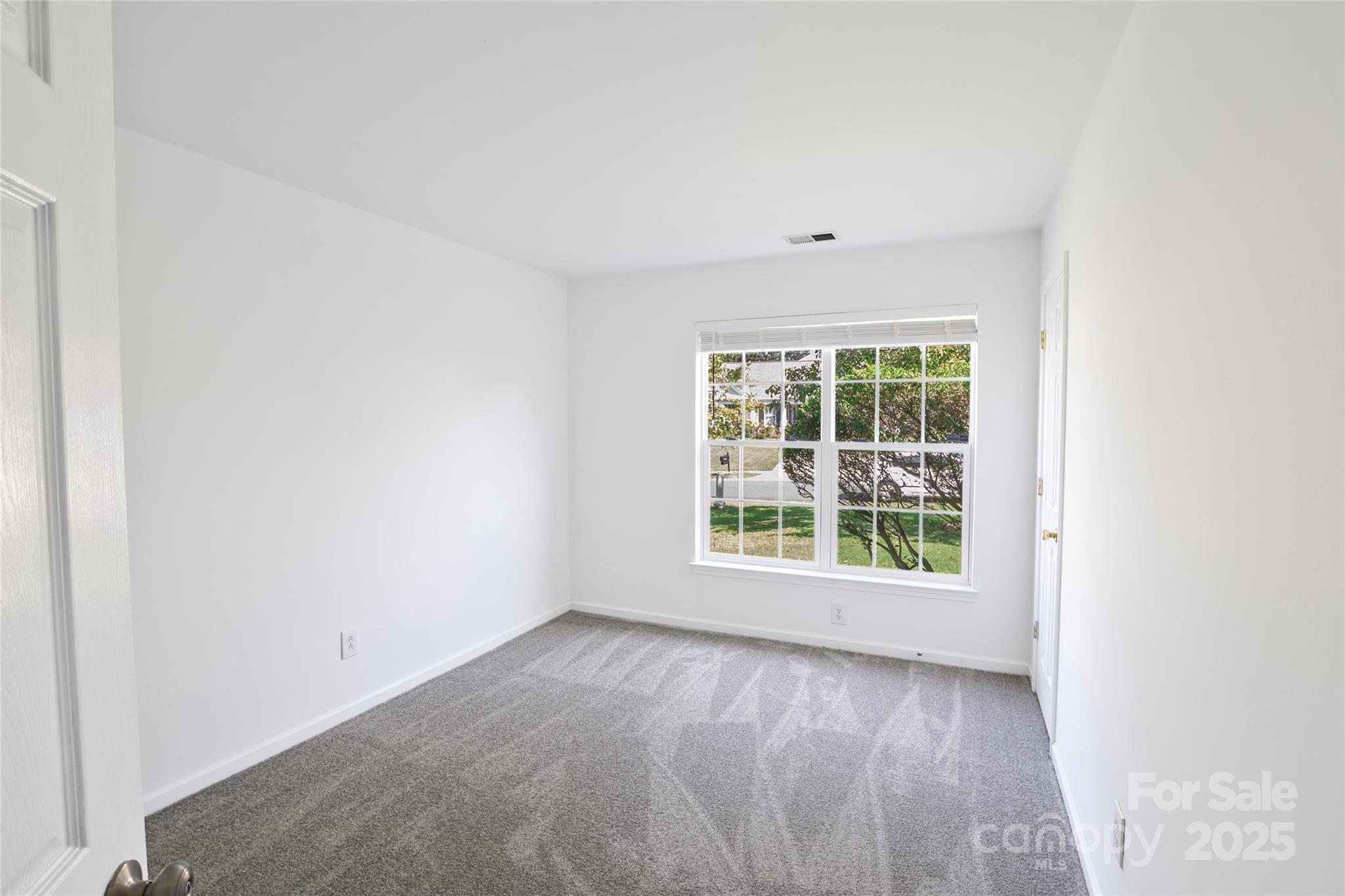 14034 Dingess Road, Unit 101 Charlotte, NC 28273 - Photo 8 of 24 an empty room with a window