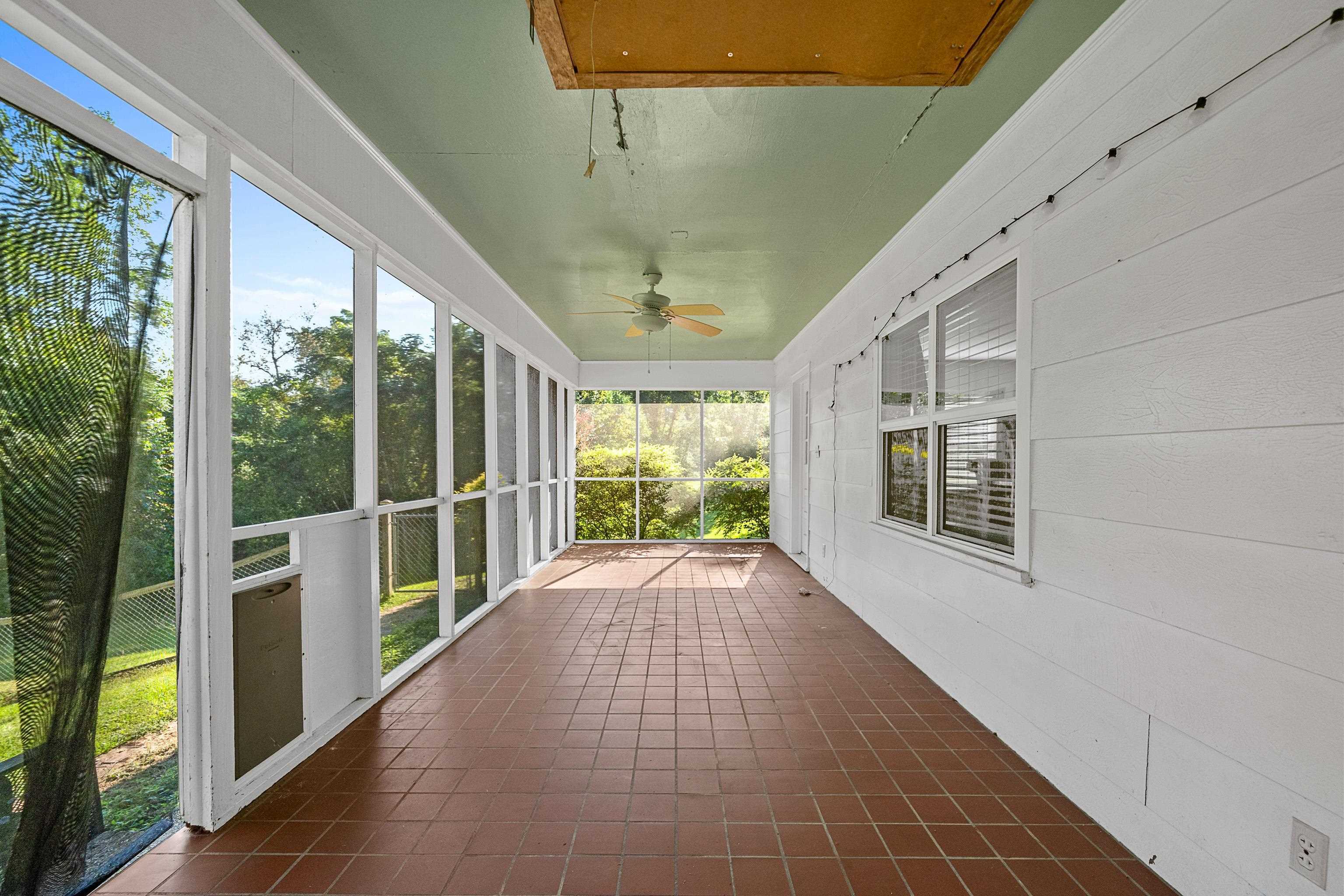 9350 Tompkins Road Stockton, AL 36579 - Photo 28 of 36 Unfurnished sunroom with plenty of natural light and ceiling fan