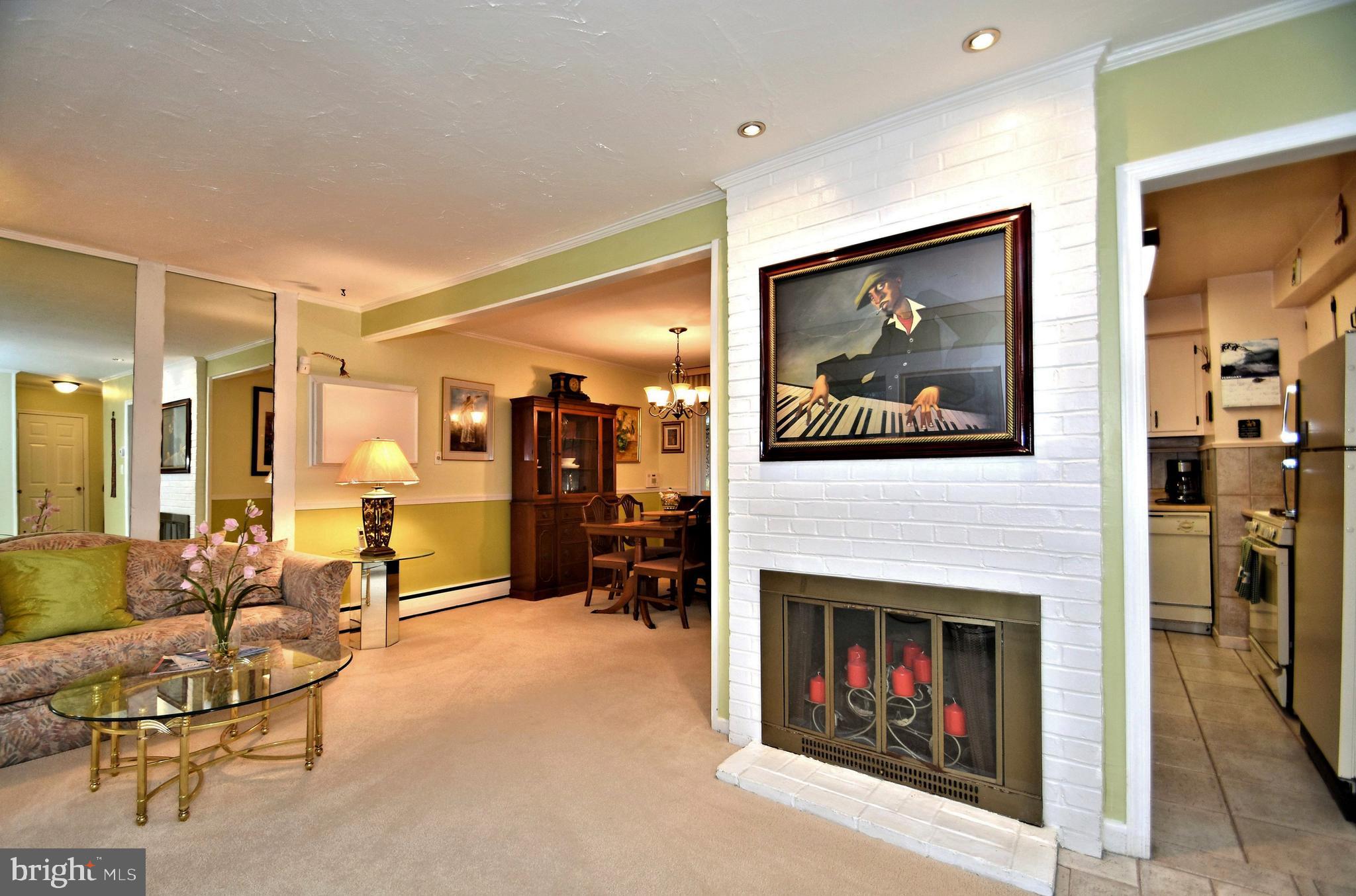 8627 Patton Road Wyndmoor, PA 19038 - Photo 6 of 31 Living room with wood burning fireplace