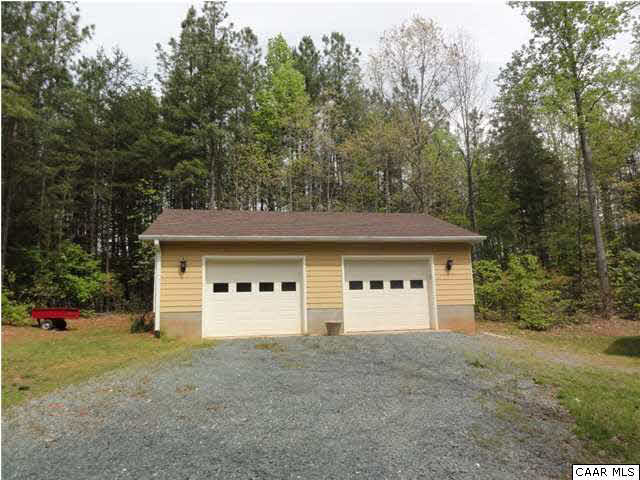4285 Venable Road Kents Store, VA 23084 - Photo 4 of 36 a view of a house with a yard and garage