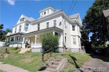44 Randolph Avenue Meriden, CT 06451 - Photo 1 of 1 a view of a white house with large windows and a yard