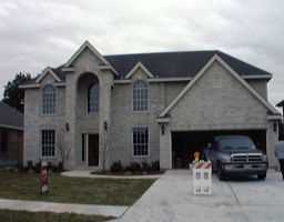 a view of car parked in front of house