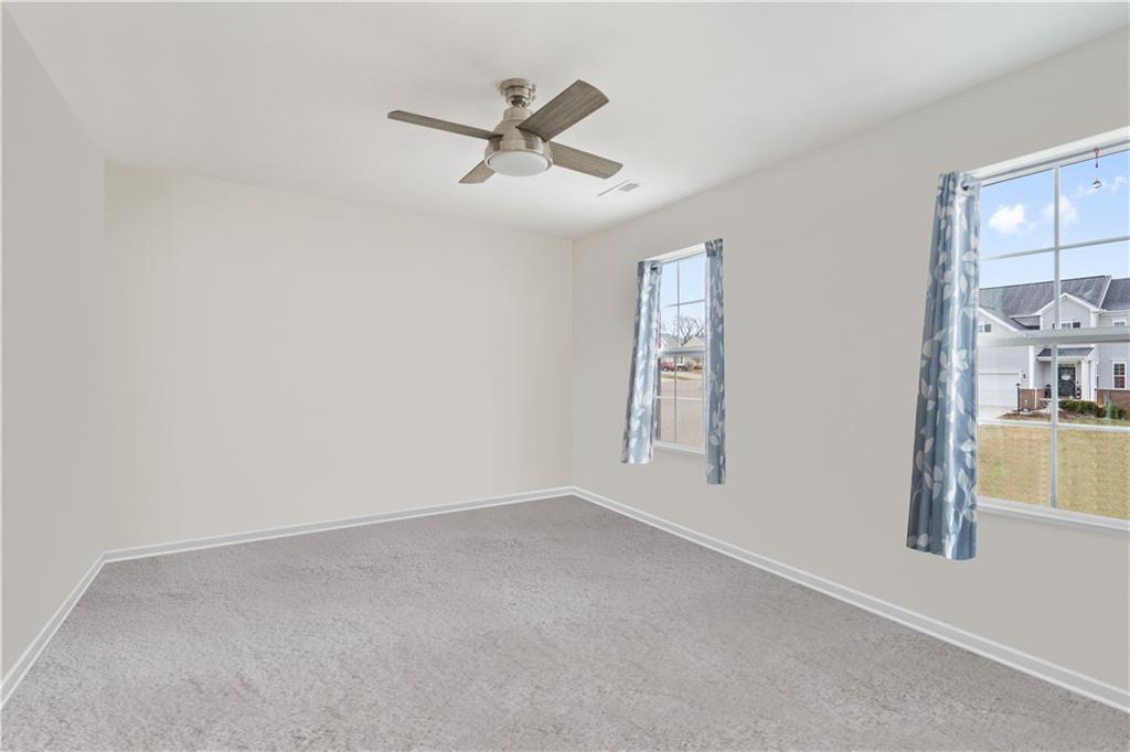 205 Wyncrest Drive Butler, PA 16001 - Photo 18 of 23 an empty room with windows and fan