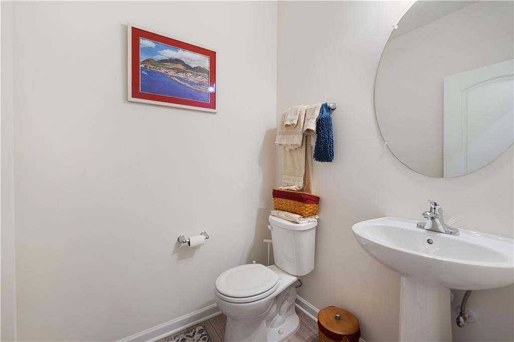 205 Wyncrest Drive Butler, PA 16001 - Photo 9 of 23 a bathroom with a toilet sink and mirror