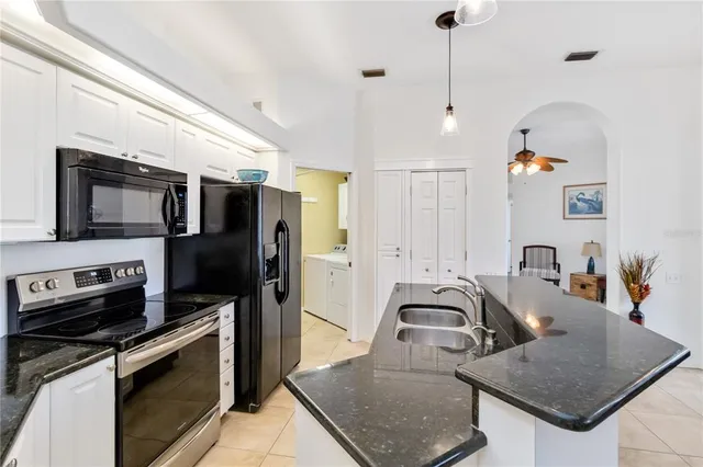 a bedroom with a bed dresser and a window