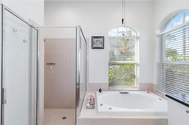 a workspace with furniture and chandelier fan