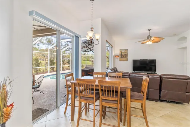 a kitchen with stainless steel appliances granite countertop a refrigerator a sink a stove and cabinets