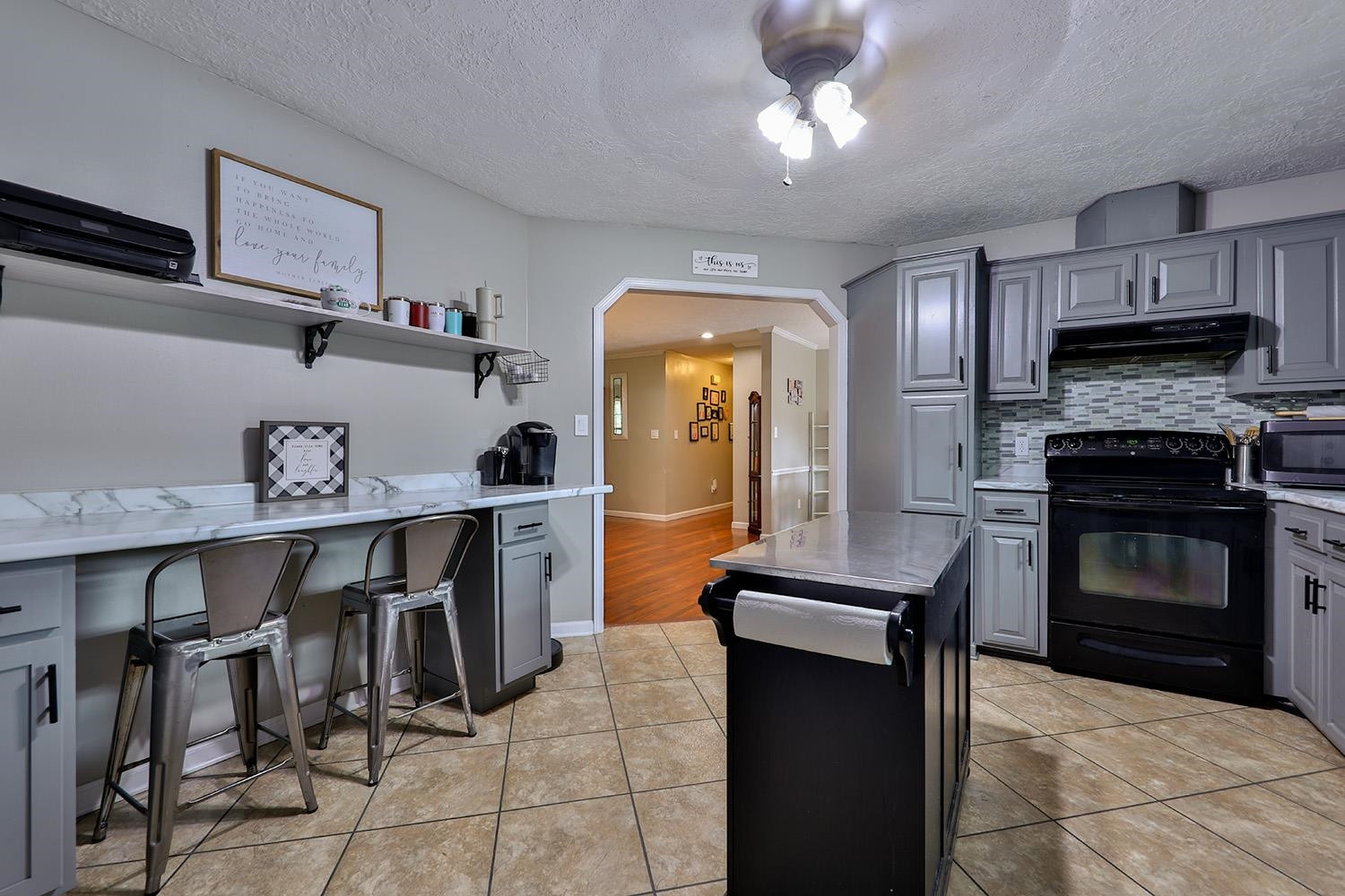 1217 Hyndsver Road Martin, TN 38237 - Photo 8 of 23 a kitchen with granite countertop a stove and a refrigerator