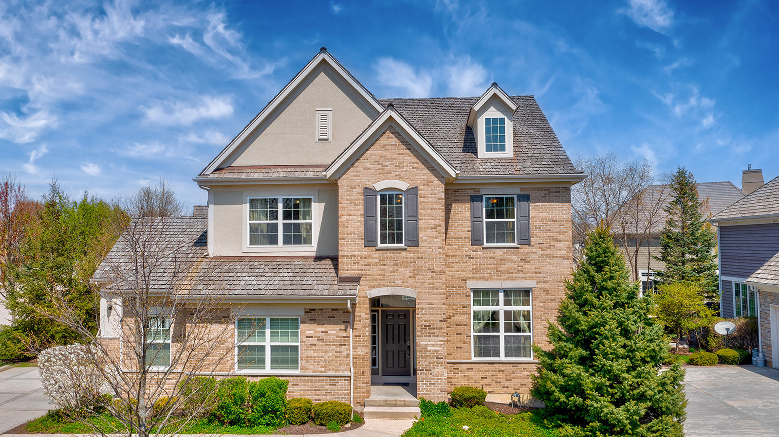 a front view of a house with garden