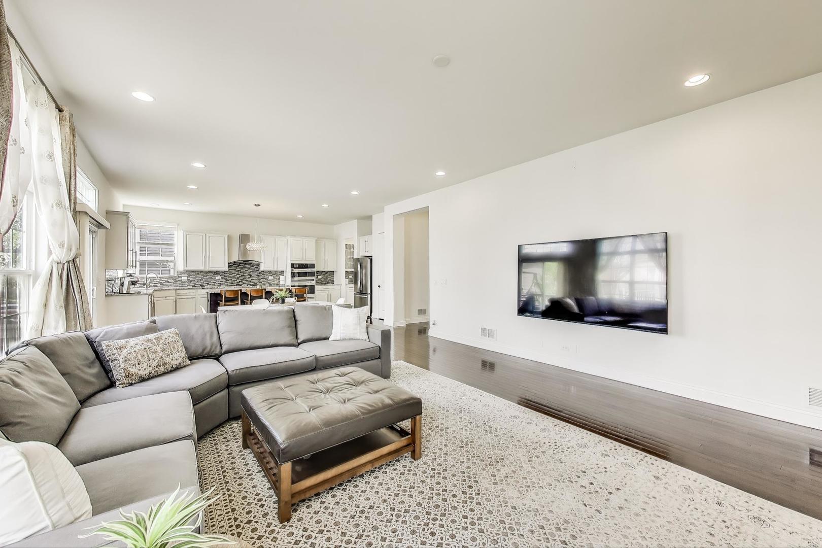 1064 Ridgeview Drive Inverness, IL 60010 - Photo 16 of 48 a living room with furniture and a flat screen tv