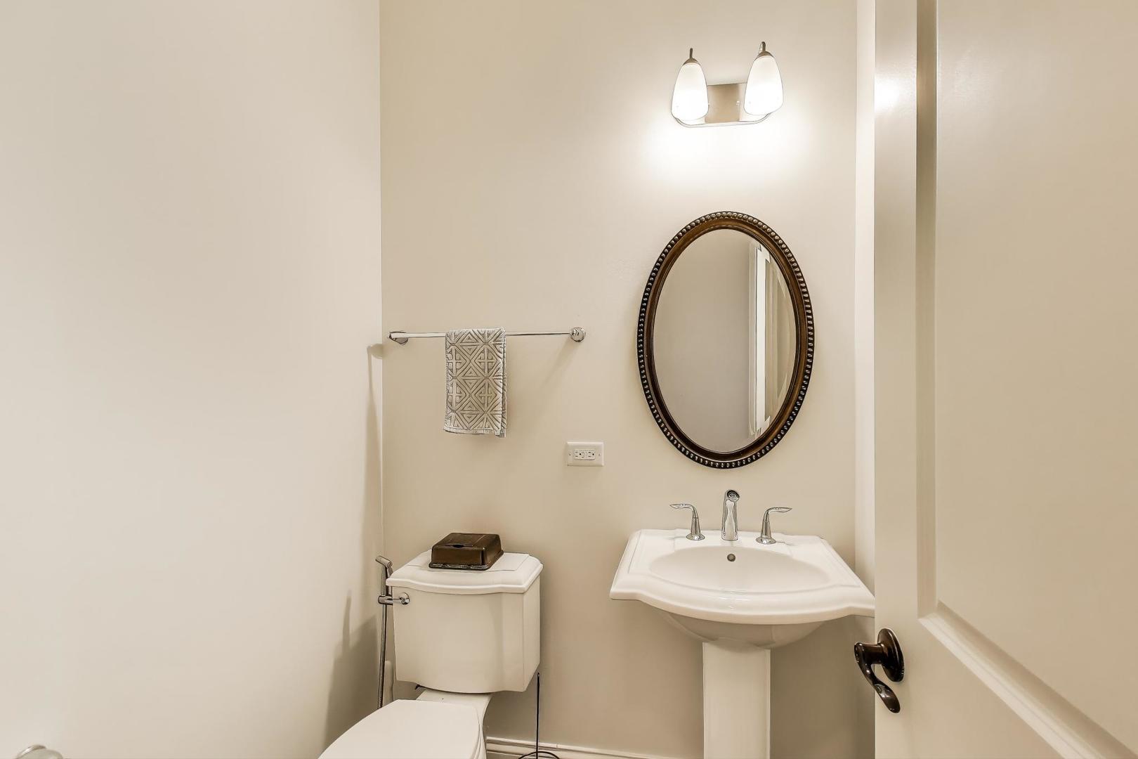 1064 Ridgeview Drive Inverness, IL 60010 - Photo 17 of 48 a bathroom with a sink and a toilet