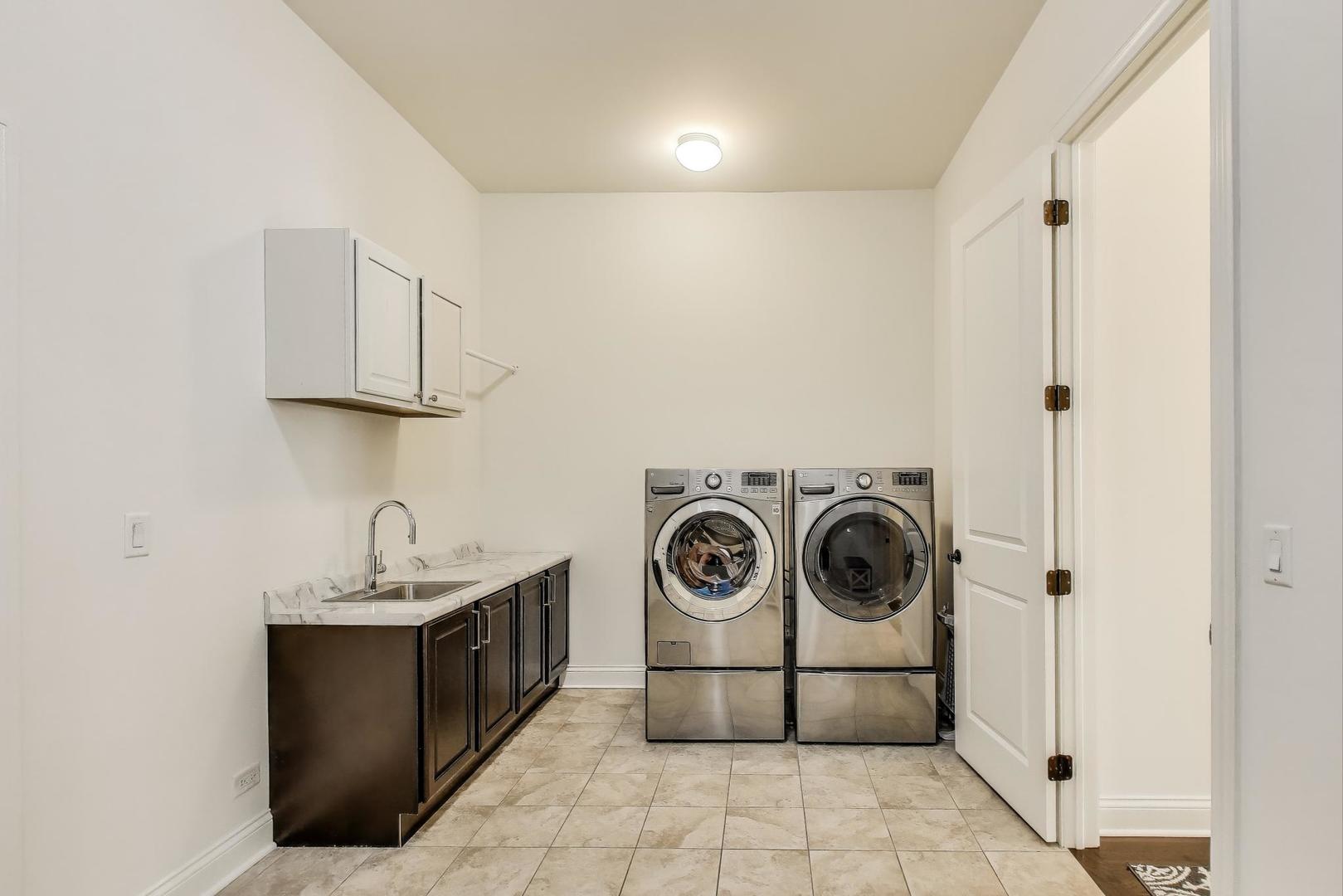 1064 Ridgeview Drive Inverness, IL 60010 - Photo 18 of 48 a utility room with dryer and washer