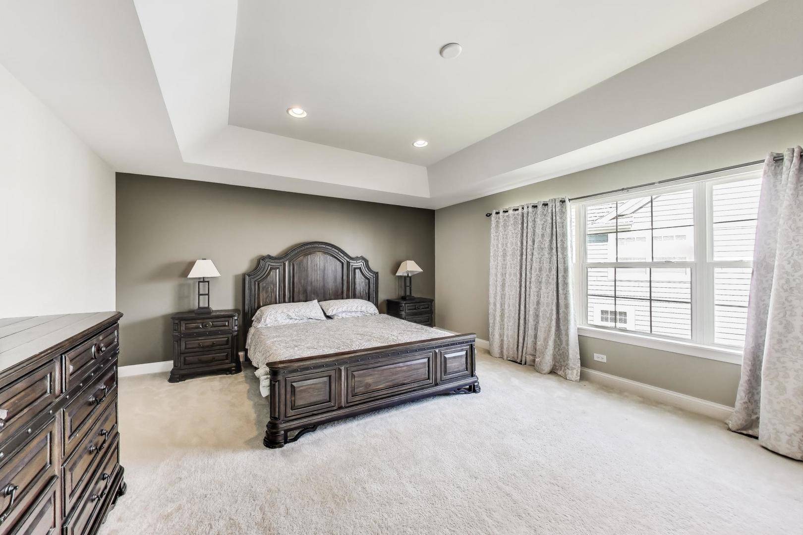 1064 Ridgeview Drive Inverness, IL 60010 - Photo 19 of 48 a spacious bedroom with a bed and window