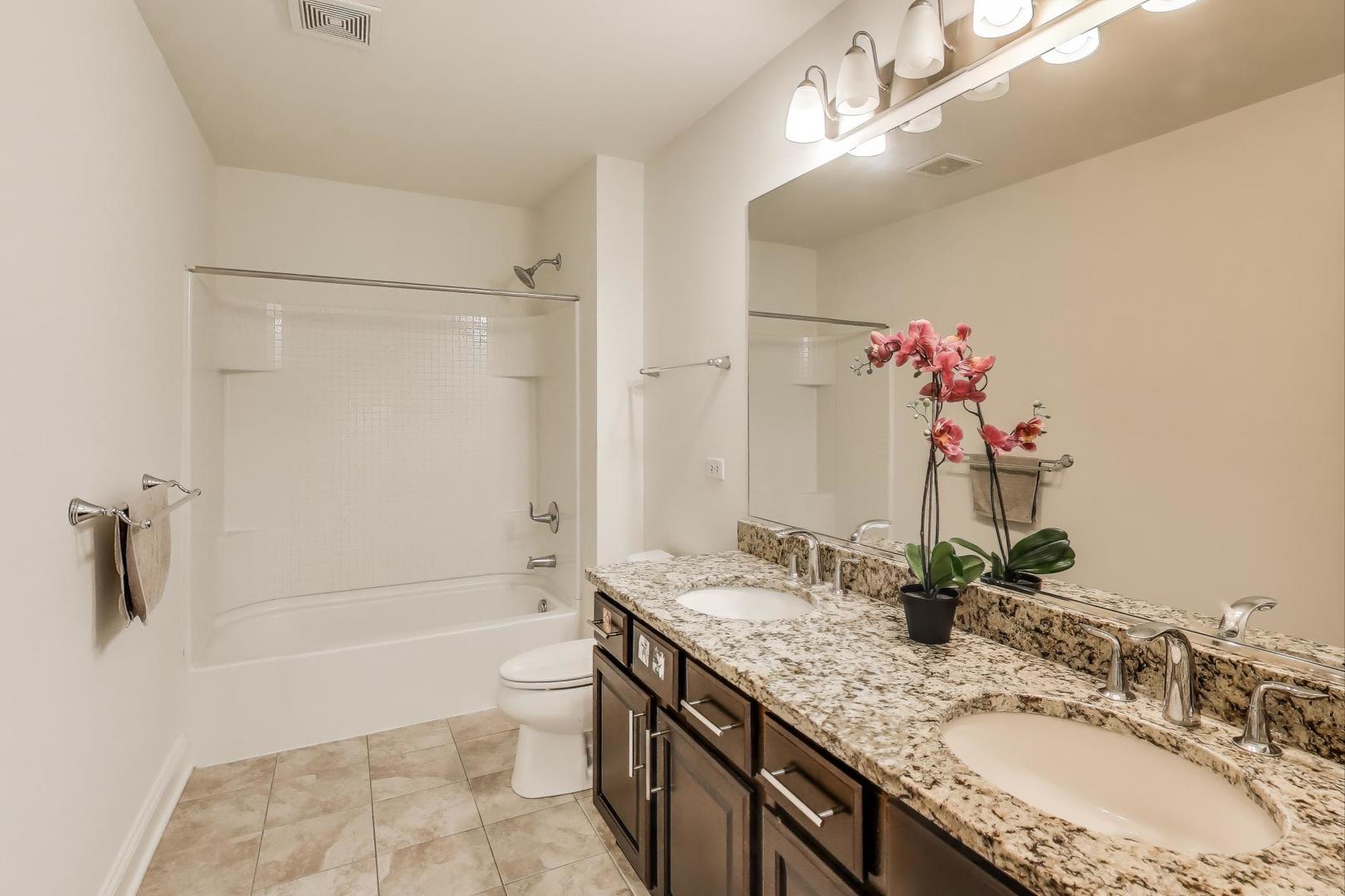 1064 Ridgeview Drive Inverness, IL 60010 - Photo 30 of 48 a bathroom with a granite countertop shower sink vanity mirror and toilet