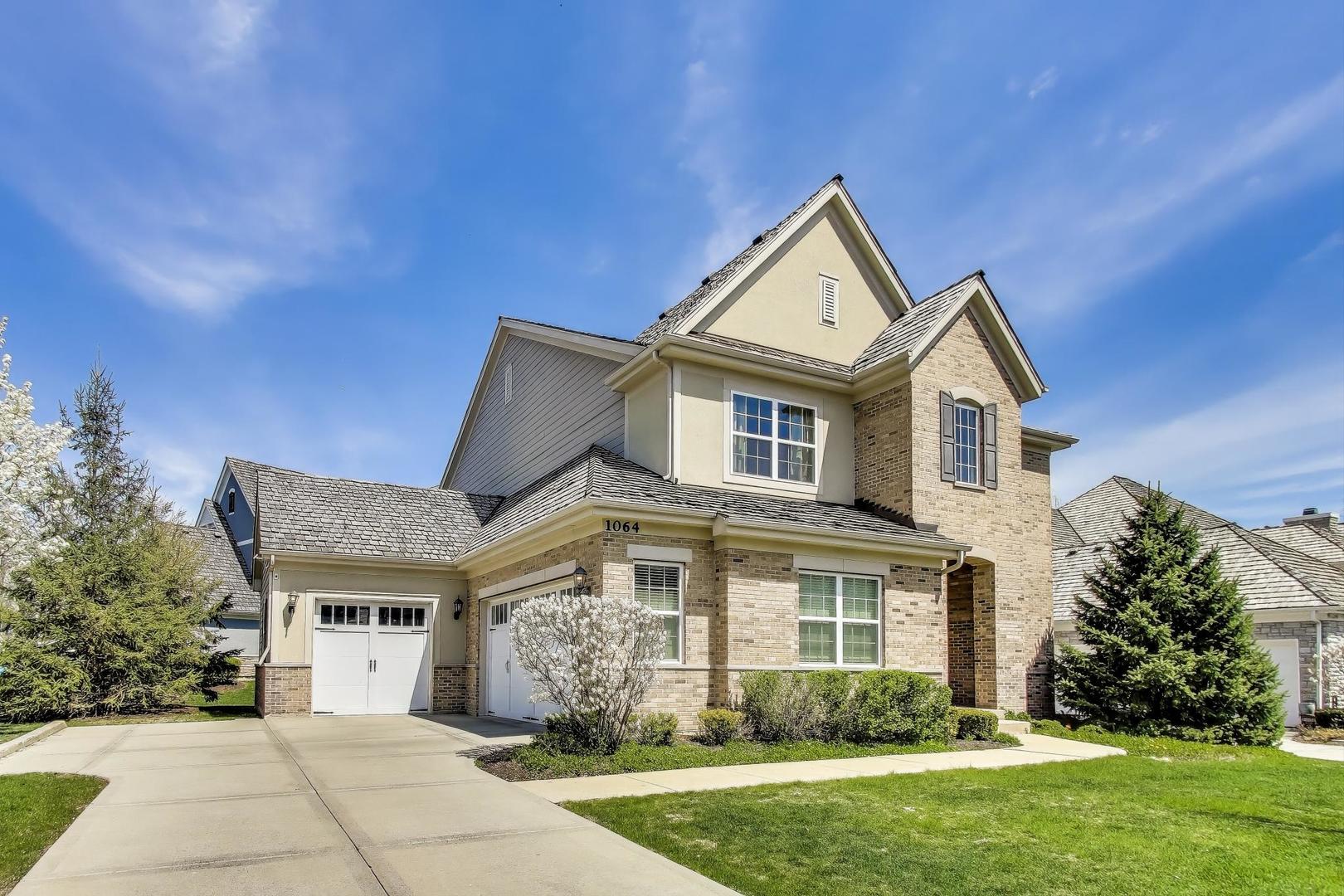1064 Ridgeview Drive Inverness, IL 60010 - Photo 3 of 48 a front view of a house with garden
