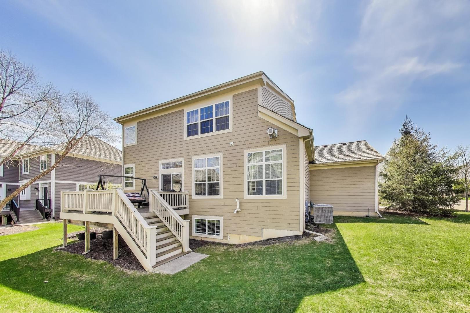 1064 Ridgeview Drive Inverness, IL 60010 - Photo 40 of 48 a front view of house with a garden and chairs
