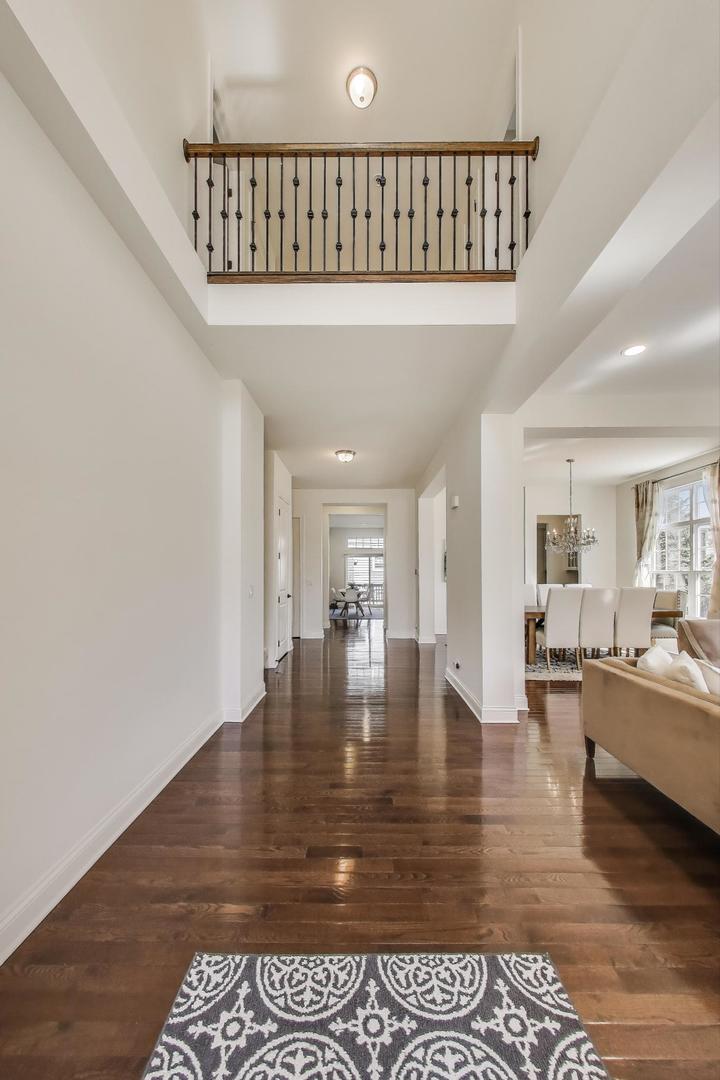 1064 Ridgeview Drive Inverness, IL 60010 - Photo 4 of 48 a dining room with furniture wooden floor and a rug