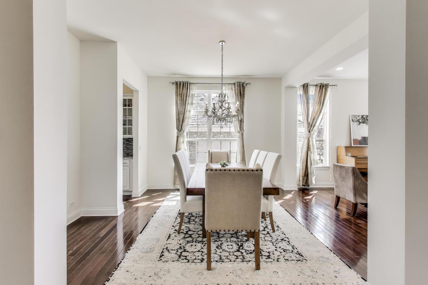 1064 Ridgeview Drive Inverness, IL 60010 - Photo 8 of 48 a view of a dining room with furniture window and wooden floor