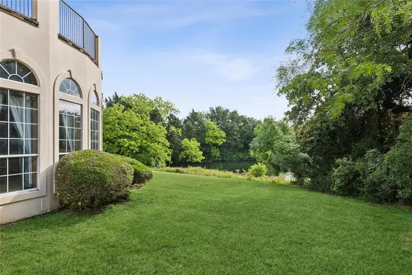 a view of a lake with a big yard