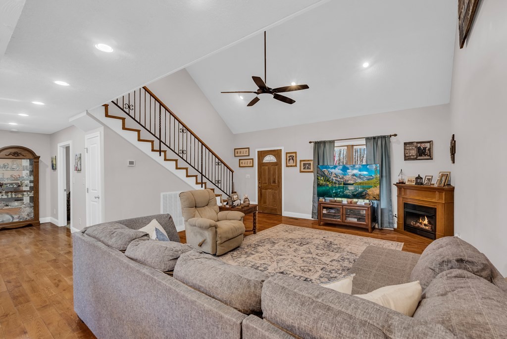 465 Hickory Lane Sparta, TN 38583 - Photo 23 of 46 a living room with furniture a fireplace and a flat screen tv