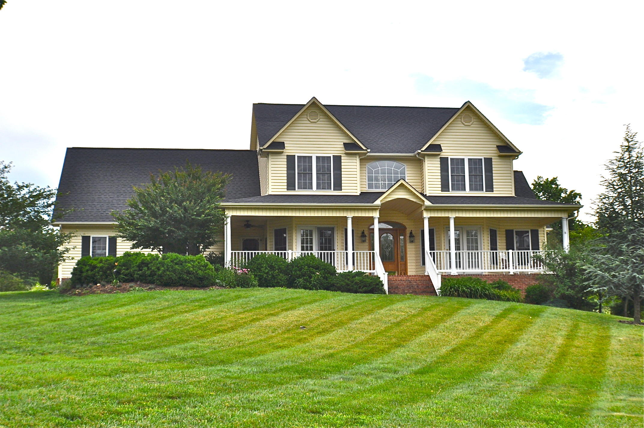 a front view of a house with garden