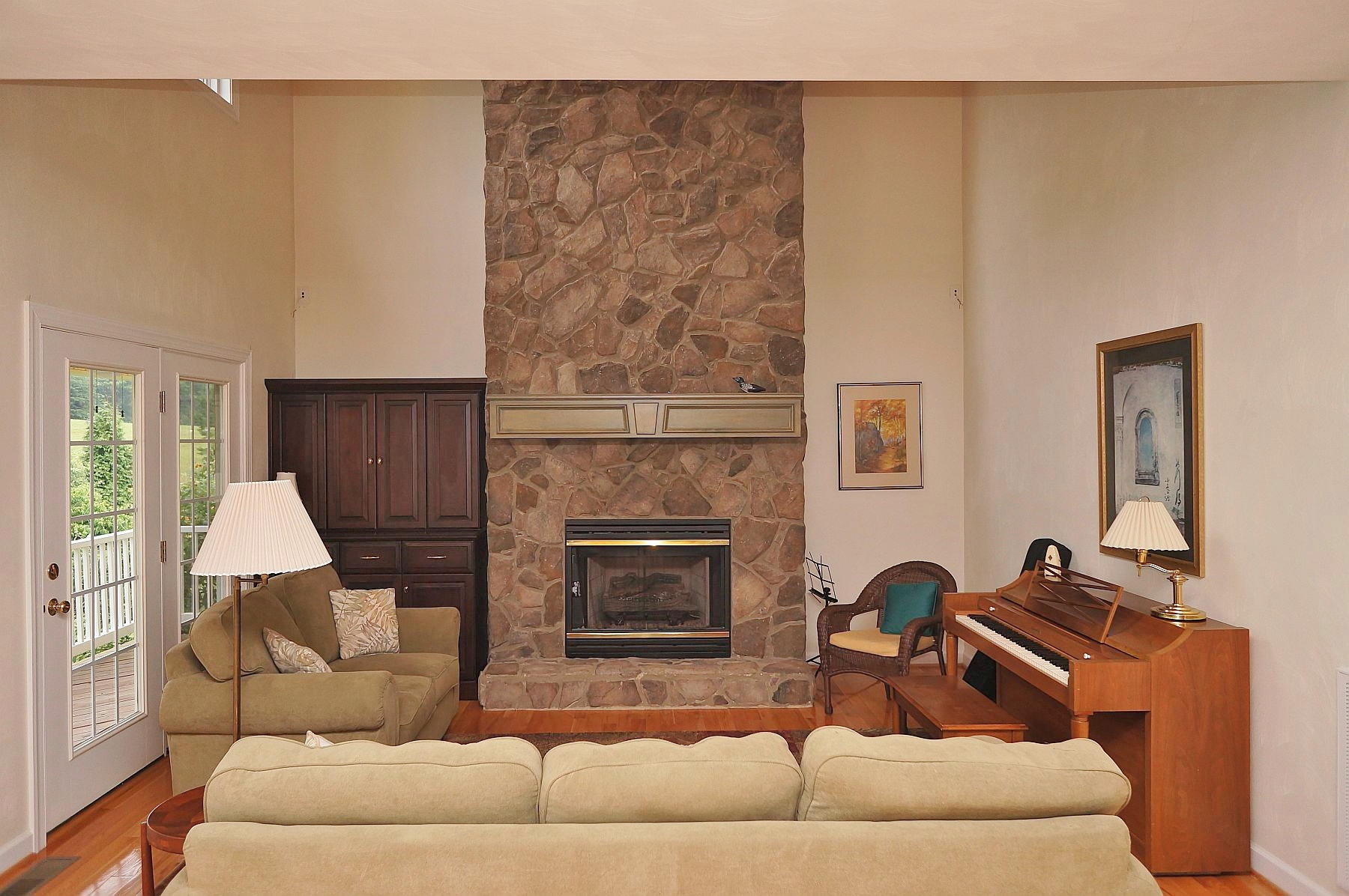 25 Claybrook Court Blue Ridge, VA 24064 - Photo 27 of 81 a living room with furniture a fireplace and a table