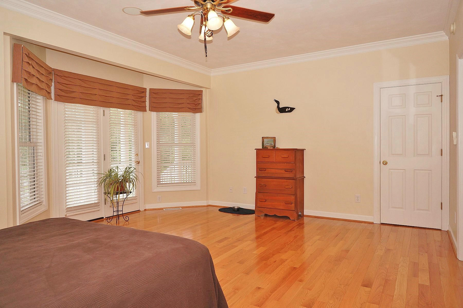 25 Claybrook Court Blue Ridge, VA 24064 - Photo 35 of 81 a bedroom with a bed and wooden floor